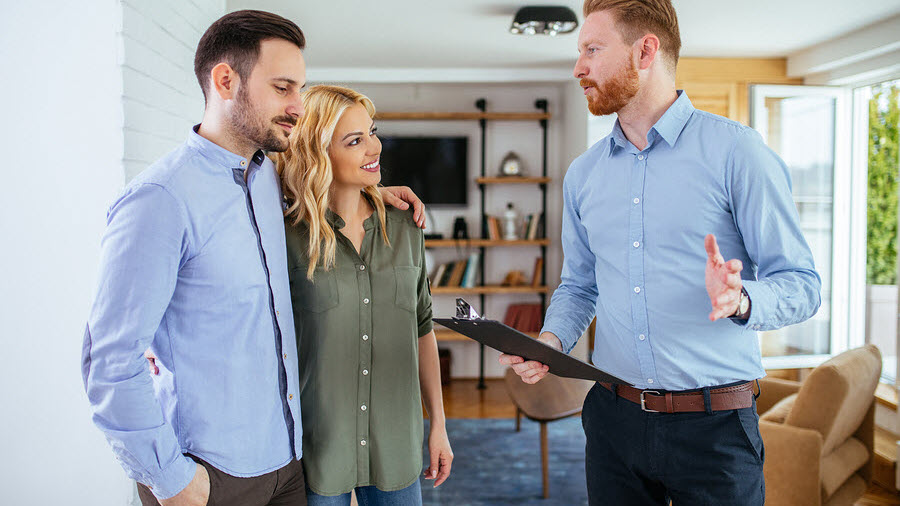 Couple Speaking to Agent