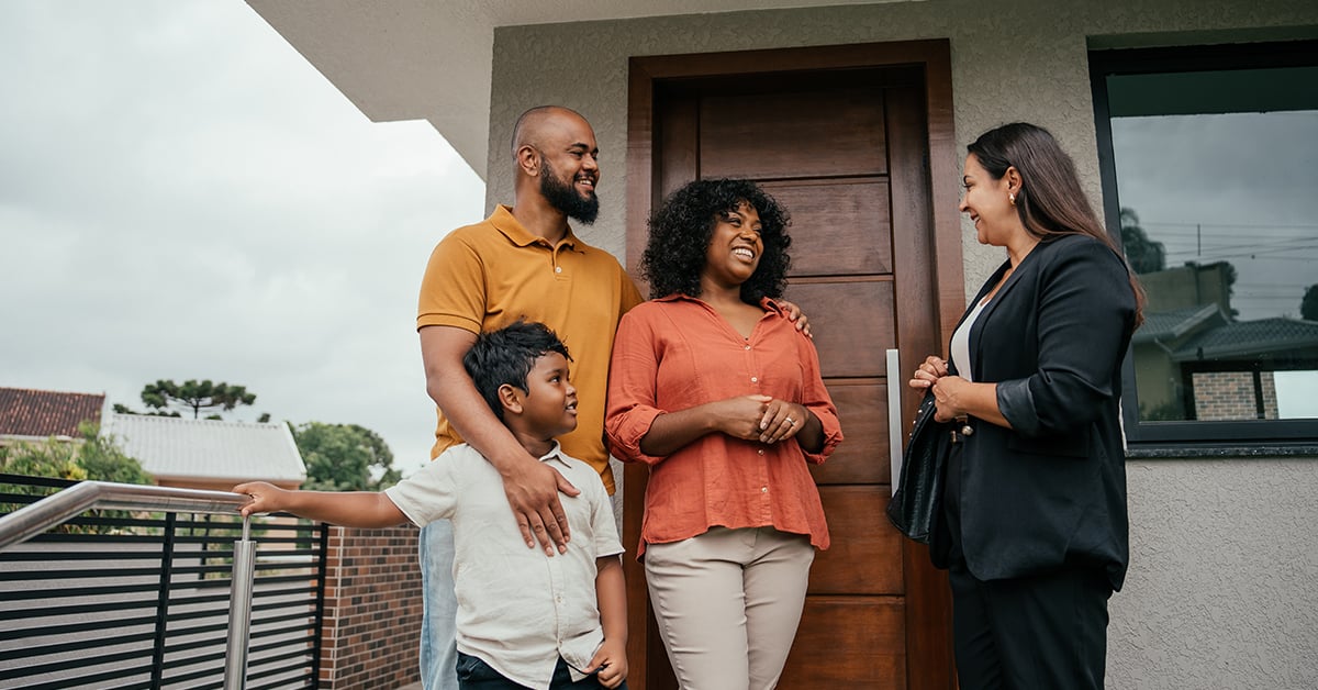 Family talking to the real estate agent