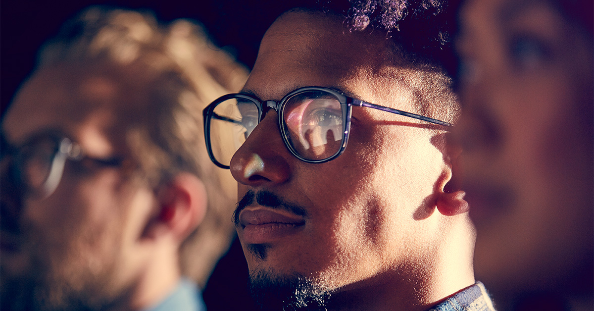 Male employee watches presentation