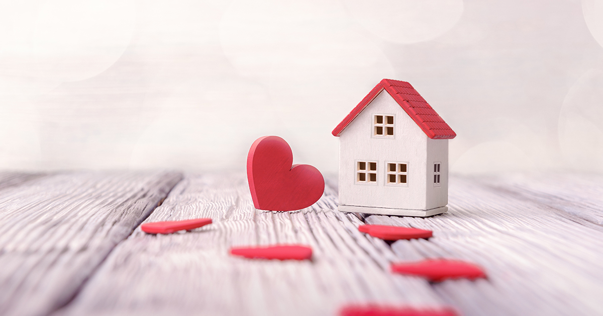 Toy house and red hearts